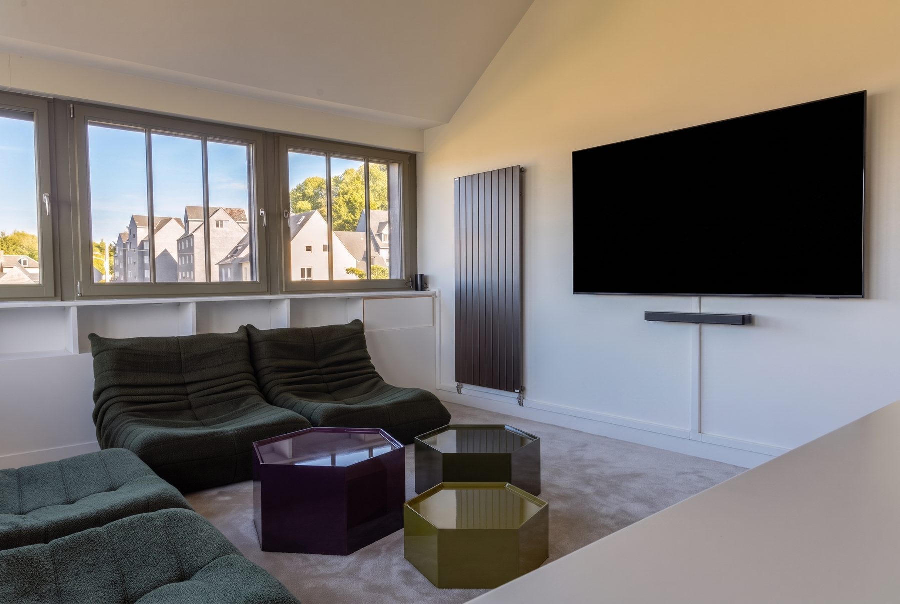 The home cinema corner of the study, sofas and big screen