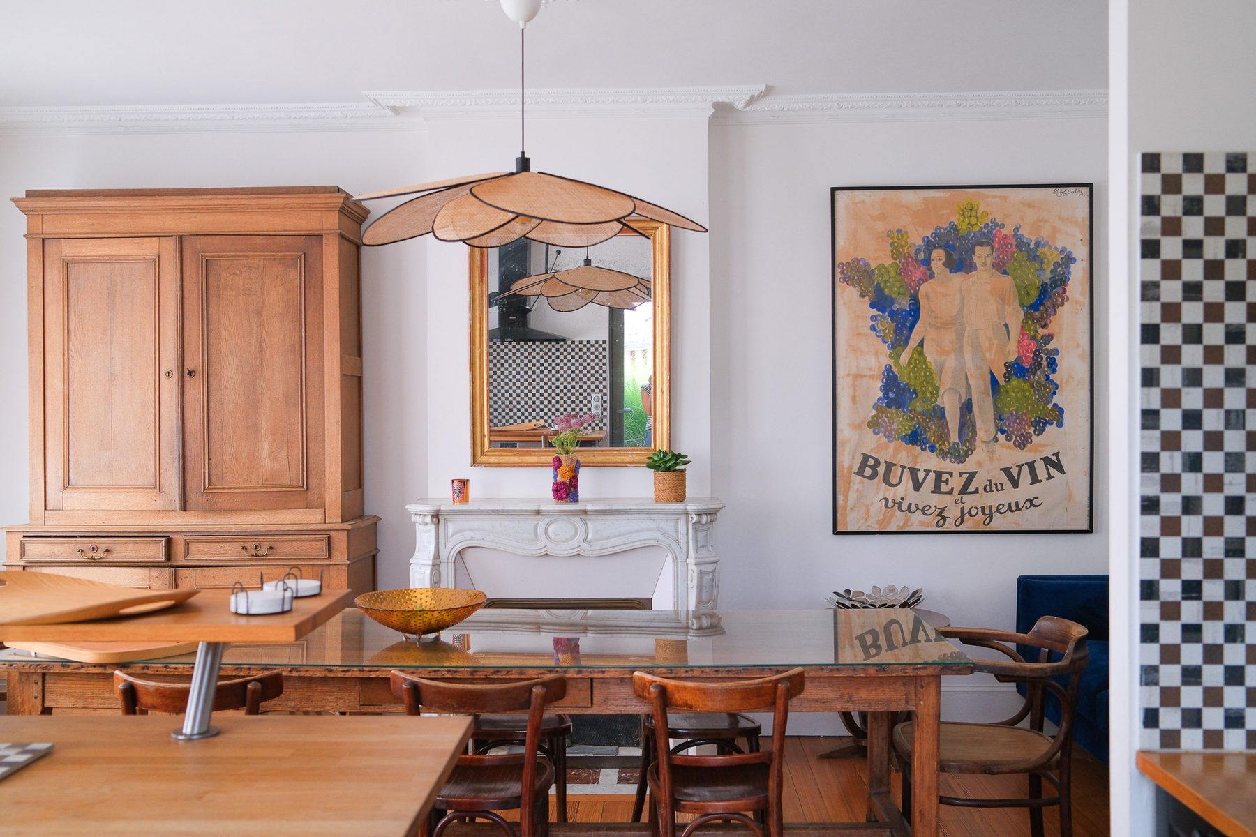 The large dining table, the wardrobe and the vintage poster