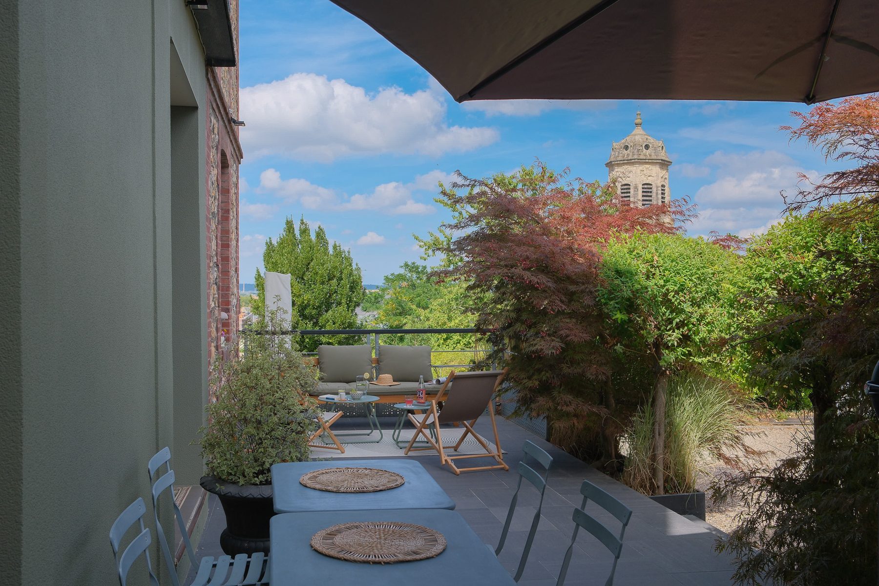 The paved terrace and the Saint-Léonard bell tower